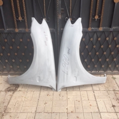 Передние крылья стеклопластиковые на Mitsubishi L200 (4G)